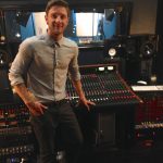 Drew Chadwick in front of the Trident 88 recording console at Ultimate Studios, Inc