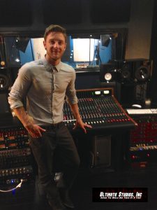 Drew Chadwick in front of the Trident 88 recording console at Ultimate Studios, Inc